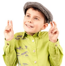 Boy making quote signs in the air at writing quotes dot com